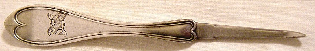 relatively plain Wilcox silverplate teaspoon with beautiful stylized USN topmark