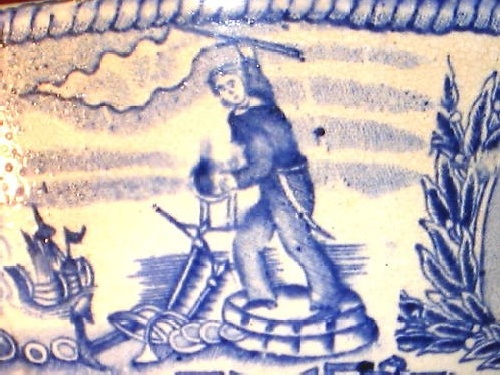 british royal navy sailor holding up flag celebrating captured booty, note anchor and other nautical loot