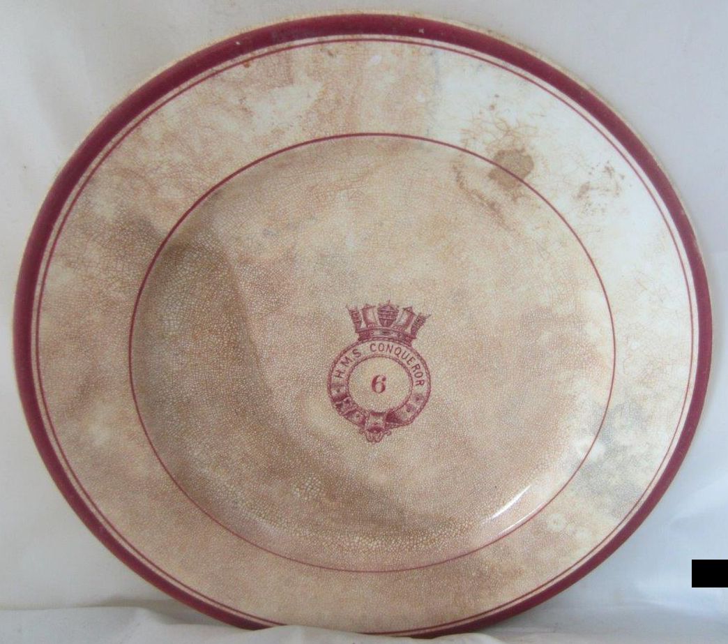 simple badge with mess 6 and nicely detailed centerpiece w/ royal navy badge and banner HMS Conqueror pre-1907