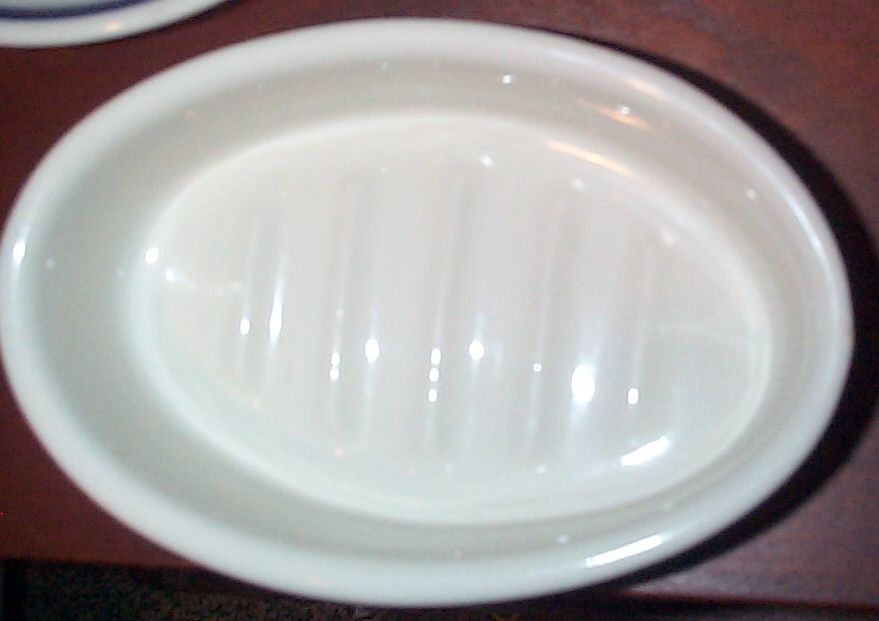 navy soap dish stamped USN, $225.