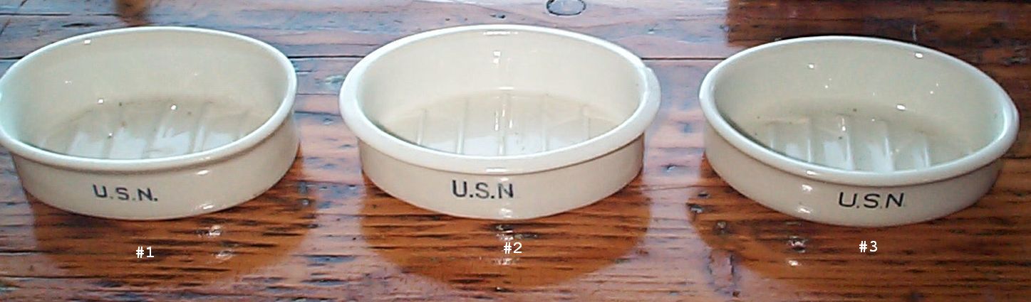 photo showing 3 navy soap dishes stamped USN front