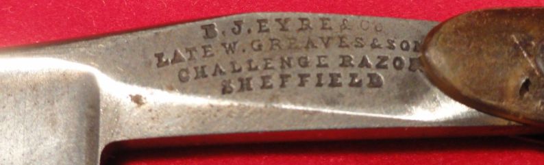 photo showing 10th century us navy straight razor stamped USN on the blade