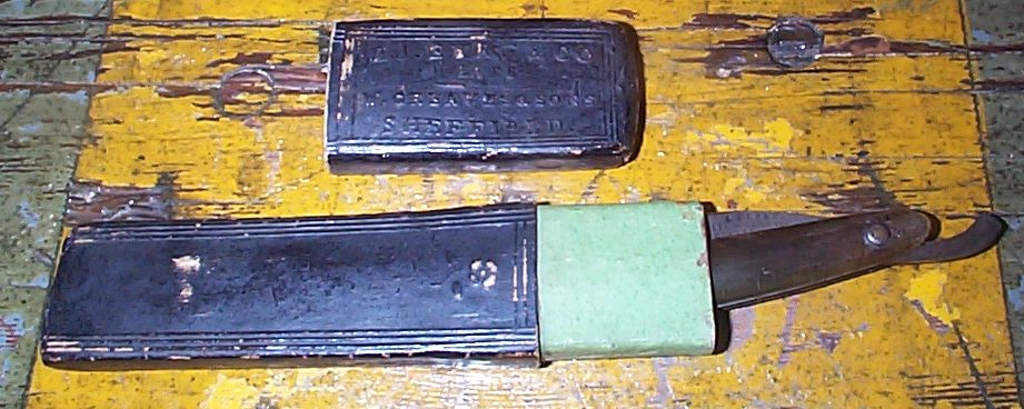 photo showing 19th century us navy straight razor stamped USN on the blade