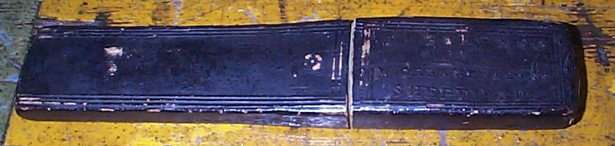 photo showing 19th century us navy straight razor stamped USN on the blade