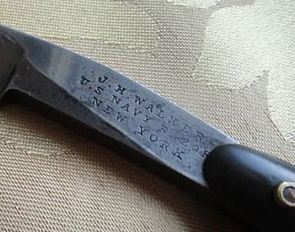 photo showing 19th century us navy straight razor stamped USN on the blade