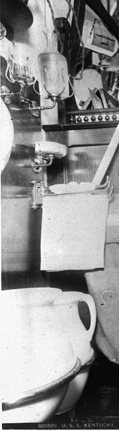 Officers berth aboard the USS Kentucky - note closeup of water pitcher, slop jar, soap dishes, water tumbler, and edge of sink to the left
