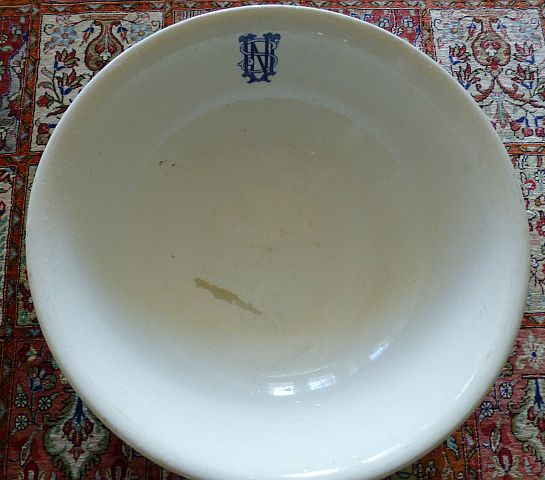 wash basin with stylized usn monogram