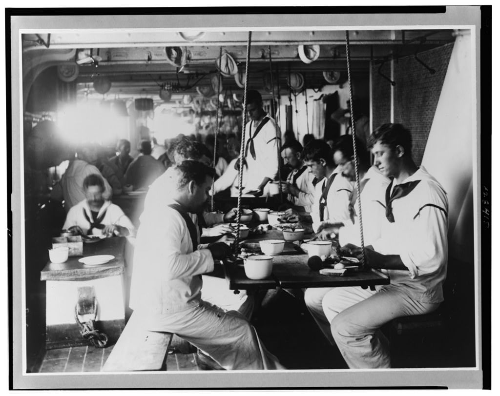 Enlisted Sailors at their Berthing Mess Aboard USS Olympia ca mid 1890's using Enamelware Plates, Cups and Bowls