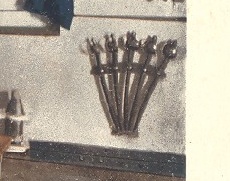Closeup of Five Model M1860 Naval Cutlass in Storage Rack in a Galley