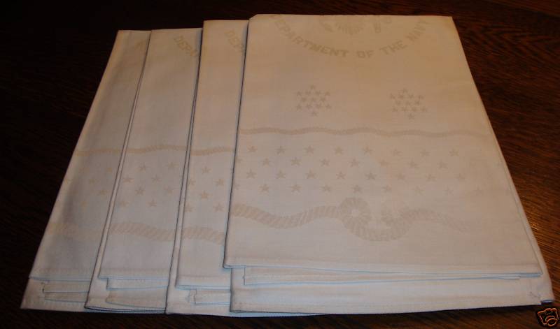 navy napkin with weaved twisted rope and department of navy seal design